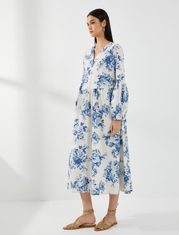   Rochie midi cu mâneci bufante și imprimeu floral.